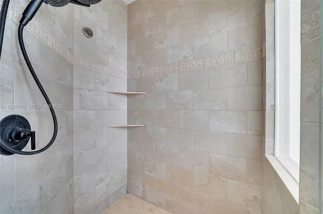 a living room with furniture a table and wooden floor