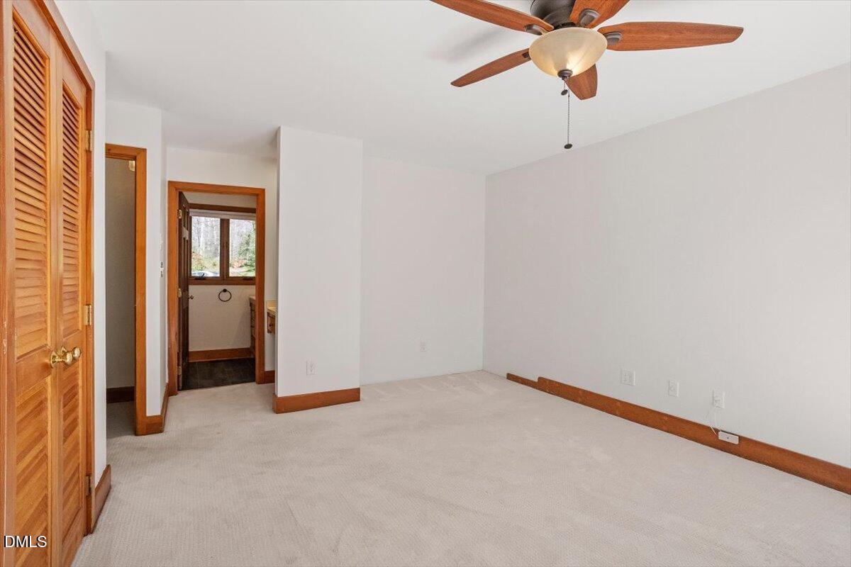 4805 Rembert Drive Raleigh, NC 27612 - Photo 24 of 45 a view of an empty room with a ceiling fan