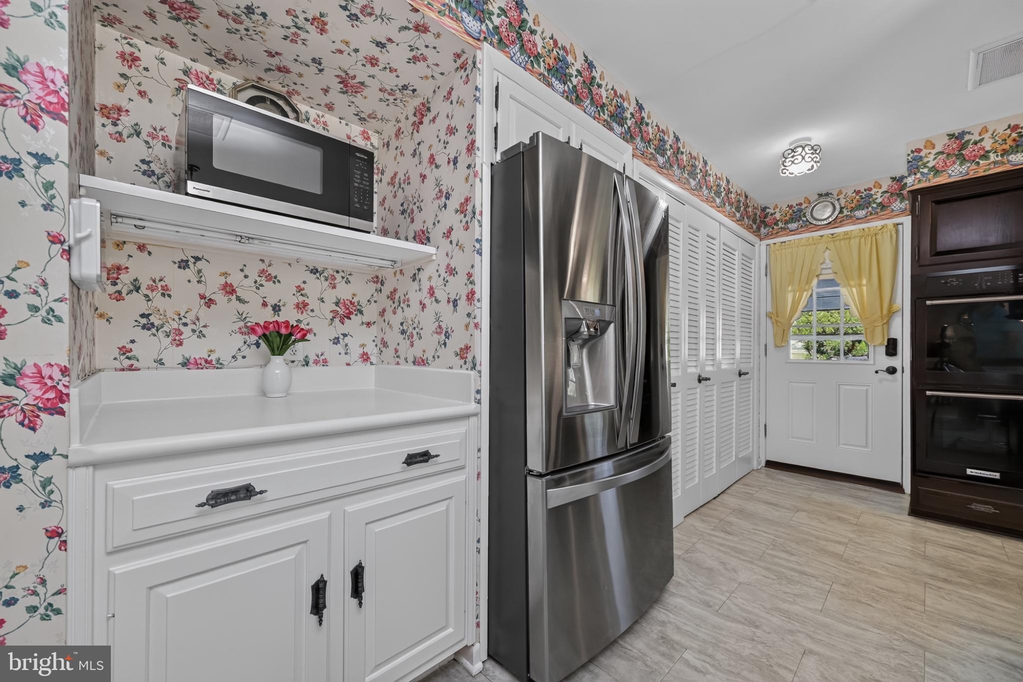 4212 Dustin Road Burtonsville, MD 20866 - Photo 24 of 65 Charming kitchen with floral accents.