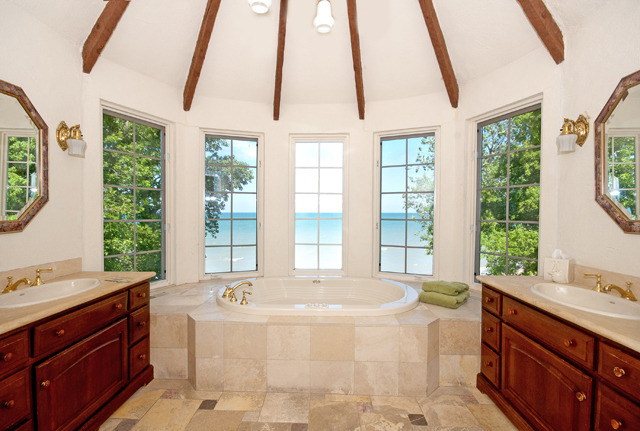 337 Sheridan Road Winnetka, IL 60093 - Photo 17 of 25 a spacious bathroom with a tub sink and large window