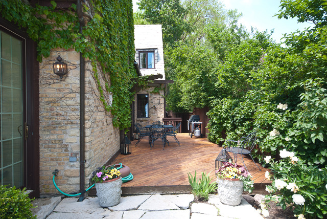 337 Sheridan Road Winnetka, IL 60093 - Photo 22 of 25 a view of a patio with table and chairs and potted plants