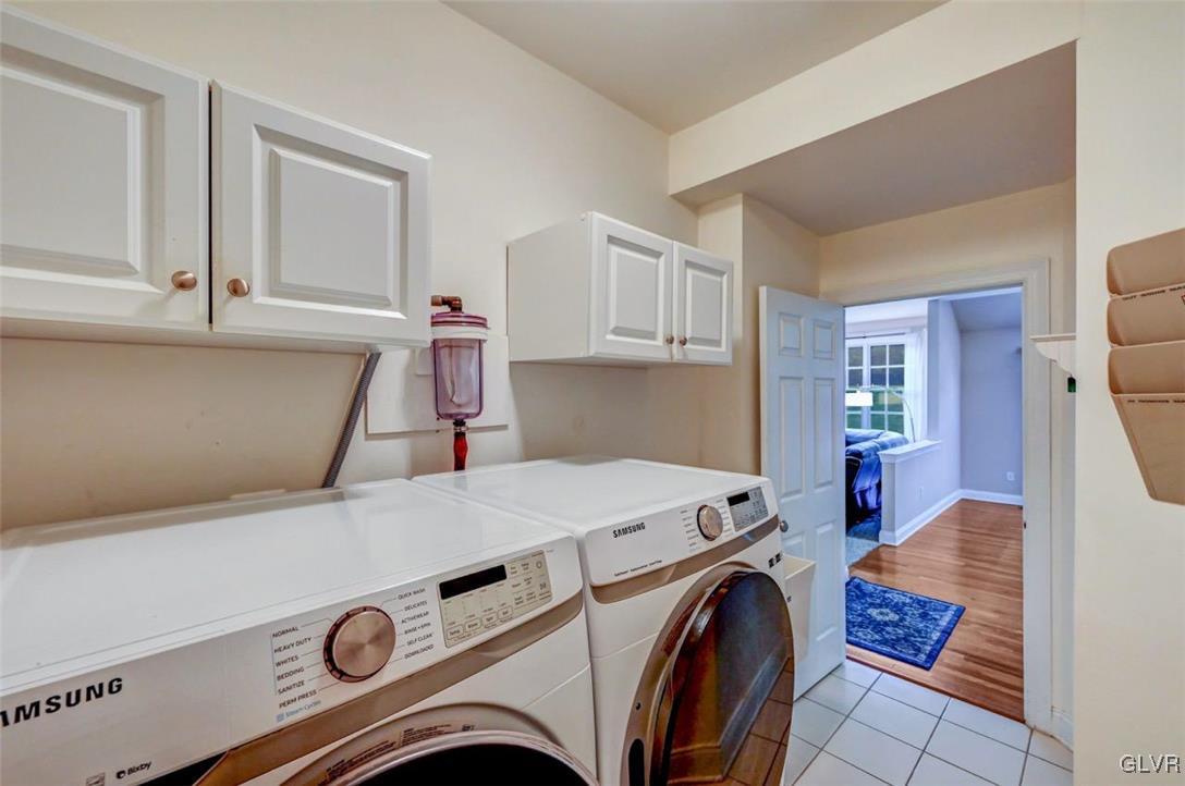 175 Jacoby Run Road Mount Bethel, PA 18343 - Photo 21 of 50 The Laundry Room has tile floors, built-in cabinet