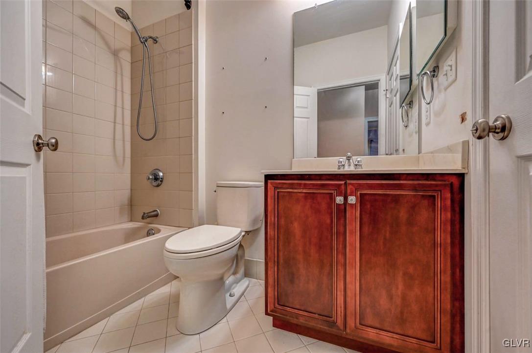 175 Jacoby Run Road Mount Bethel, PA 18343 - Photo 34 of 50 The Hall Bath has tile floors, a tiled tub surroun