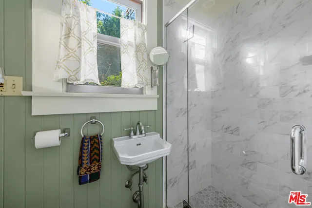 a bathroom with a sink and mirror