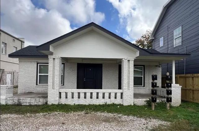 front view of a house with a yard
