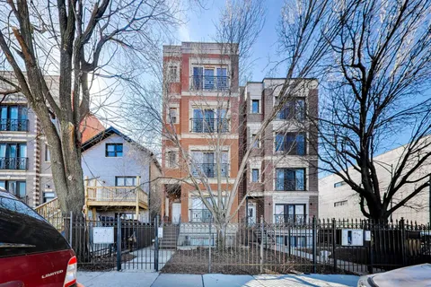 a view of a building with a yard