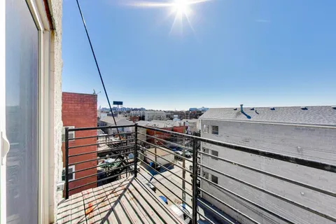 a view of a balcony with an outdoor space