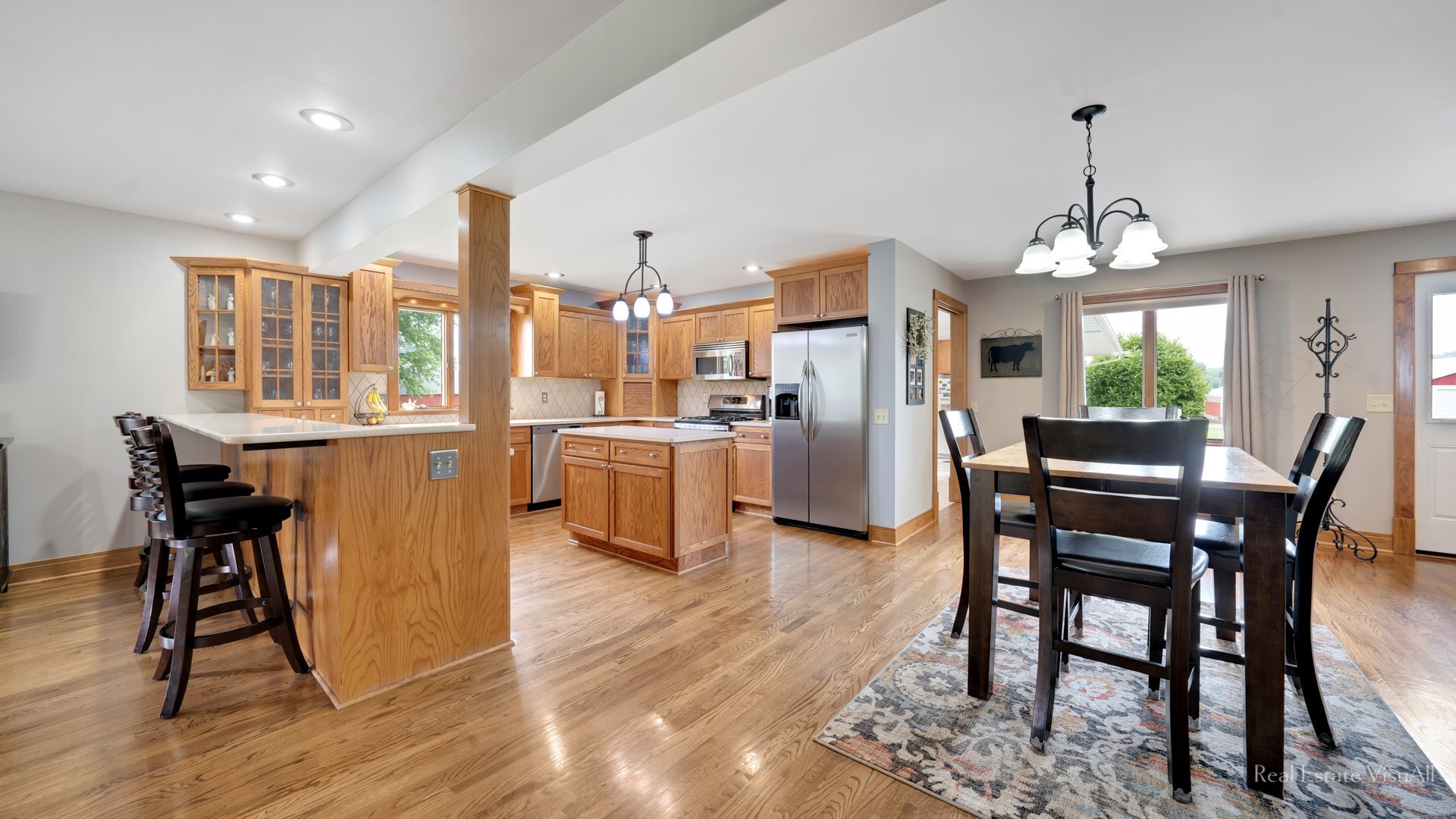 20216 Beck Road Marengo, IL 60152 - Photo 54 of 60 a dining room with furniture a chandelier and wooden floor