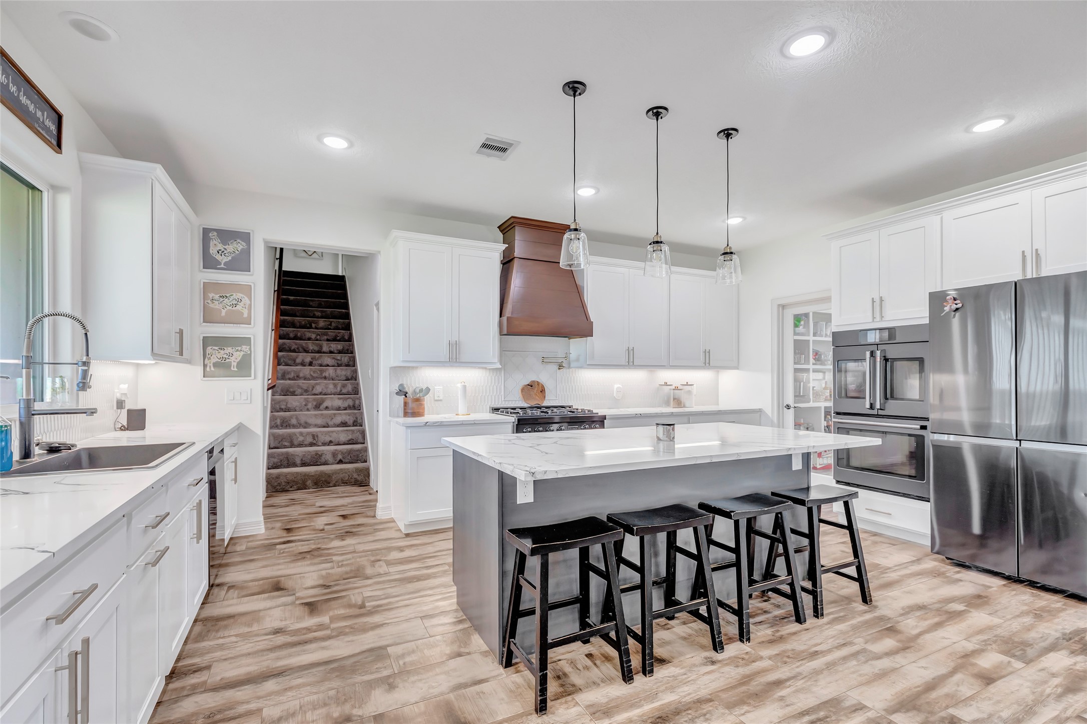 136 Timber Ridge Road Liberty, TX 77575 - Photo 11 of 50 a kitchen with stainless steel appliances kitchen island granite countertop a sink and cabinets