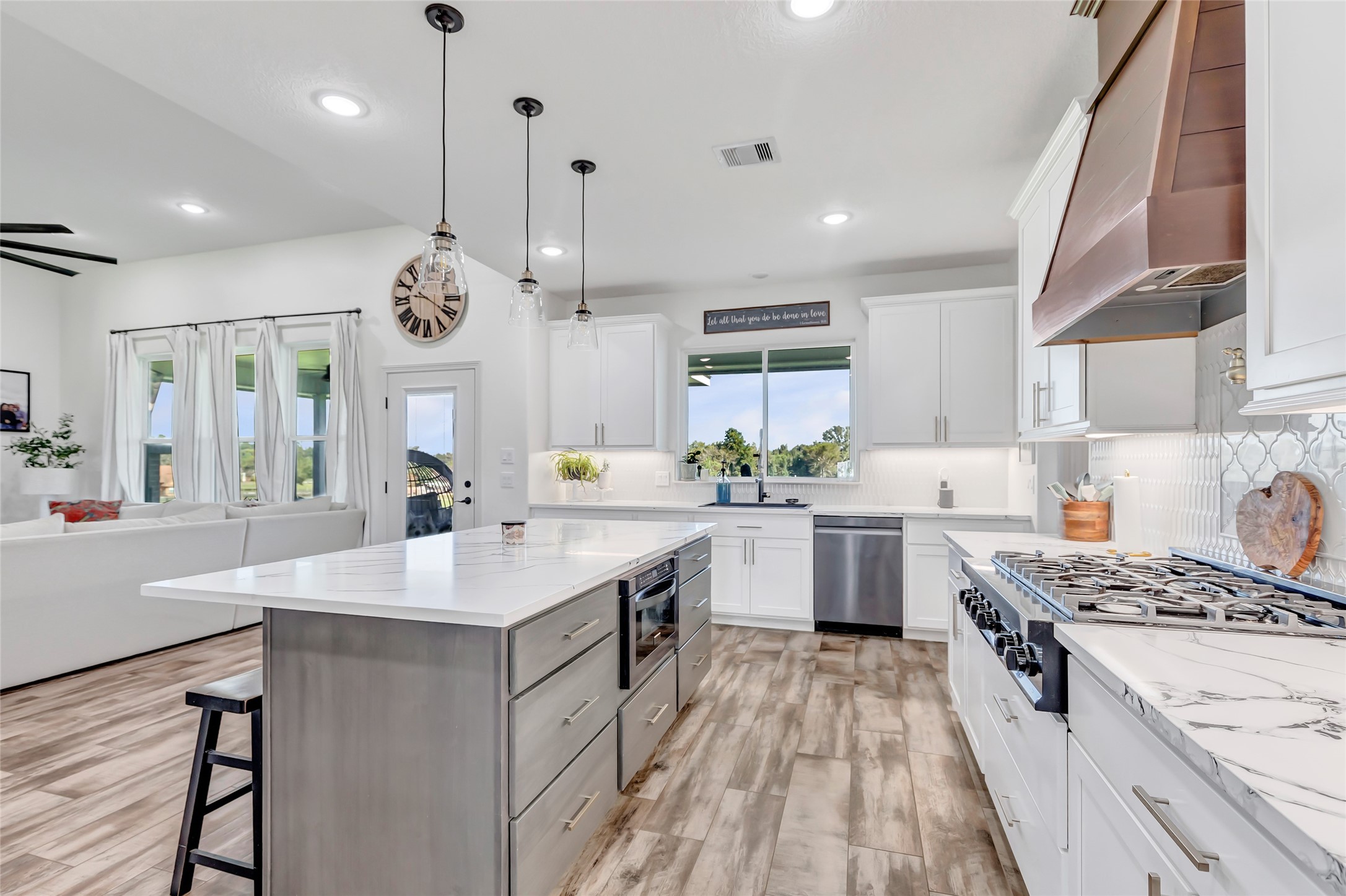 136 Timber Ridge Road Liberty, TX 77575 - Photo 13 of 50 a kitchen with a sink stove and cabinets