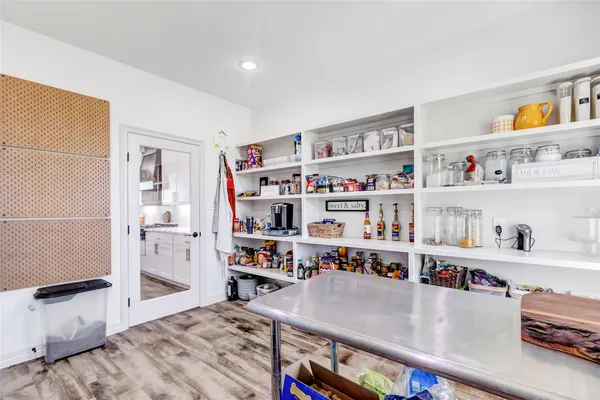 a view of walk in closet with clothes