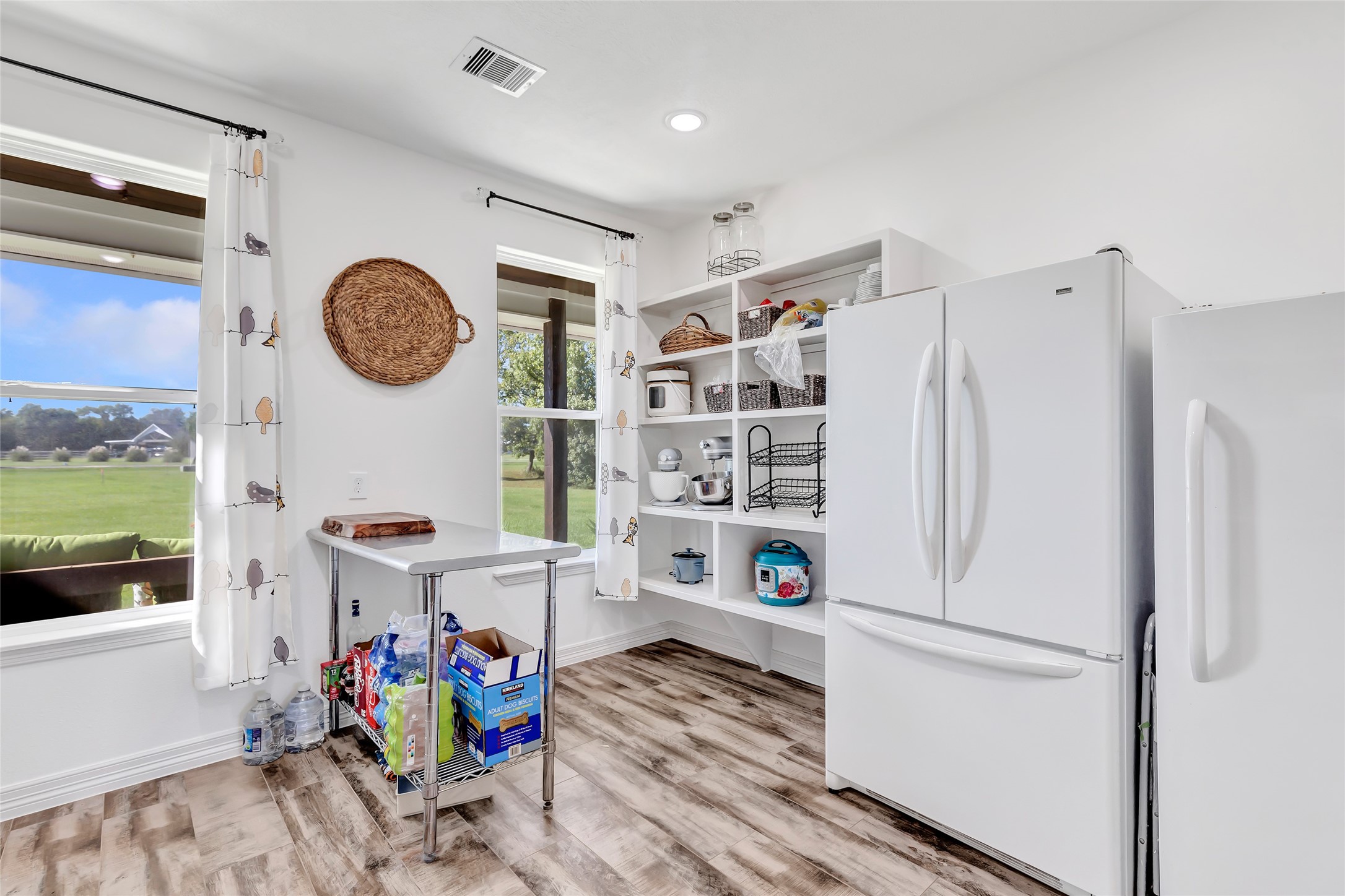 136 Timber Ridge Road Liberty, TX 77575 - Photo 15 of 50 a white kitchen with a refrigerator and a stove