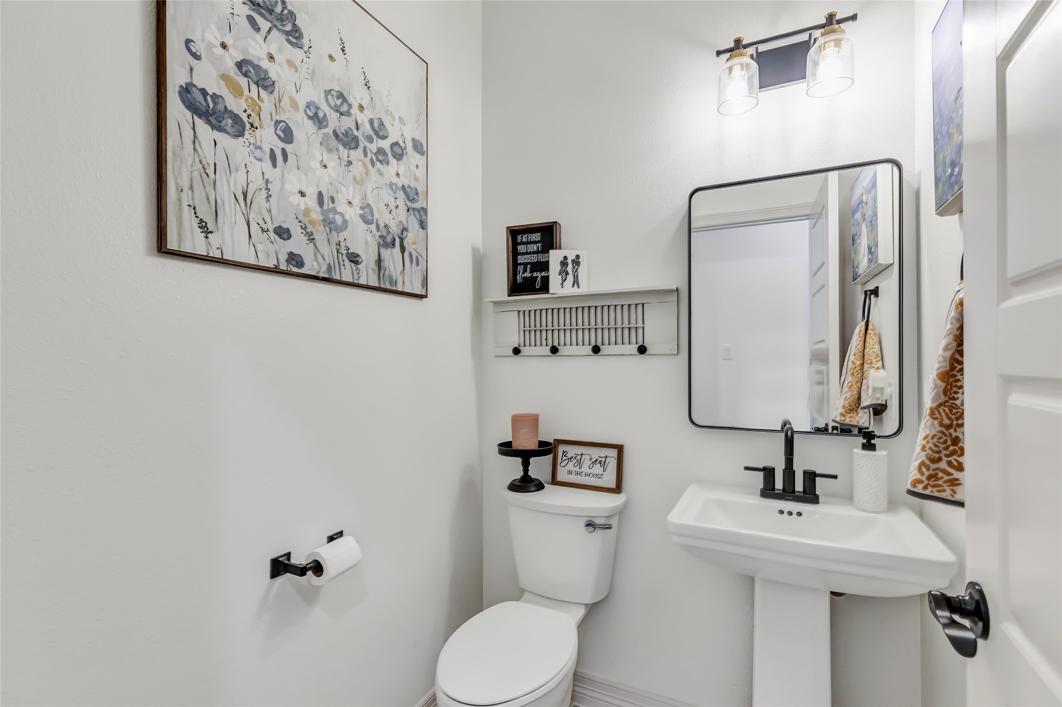 136 Timber Ridge Road Liberty, TX 77575 - Photo 16 of 50 a bathroom with a toilet sink and mirror