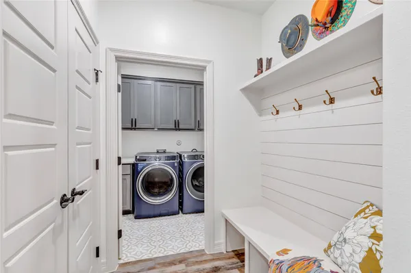 a bathroom with a sink double vanity and a toilet