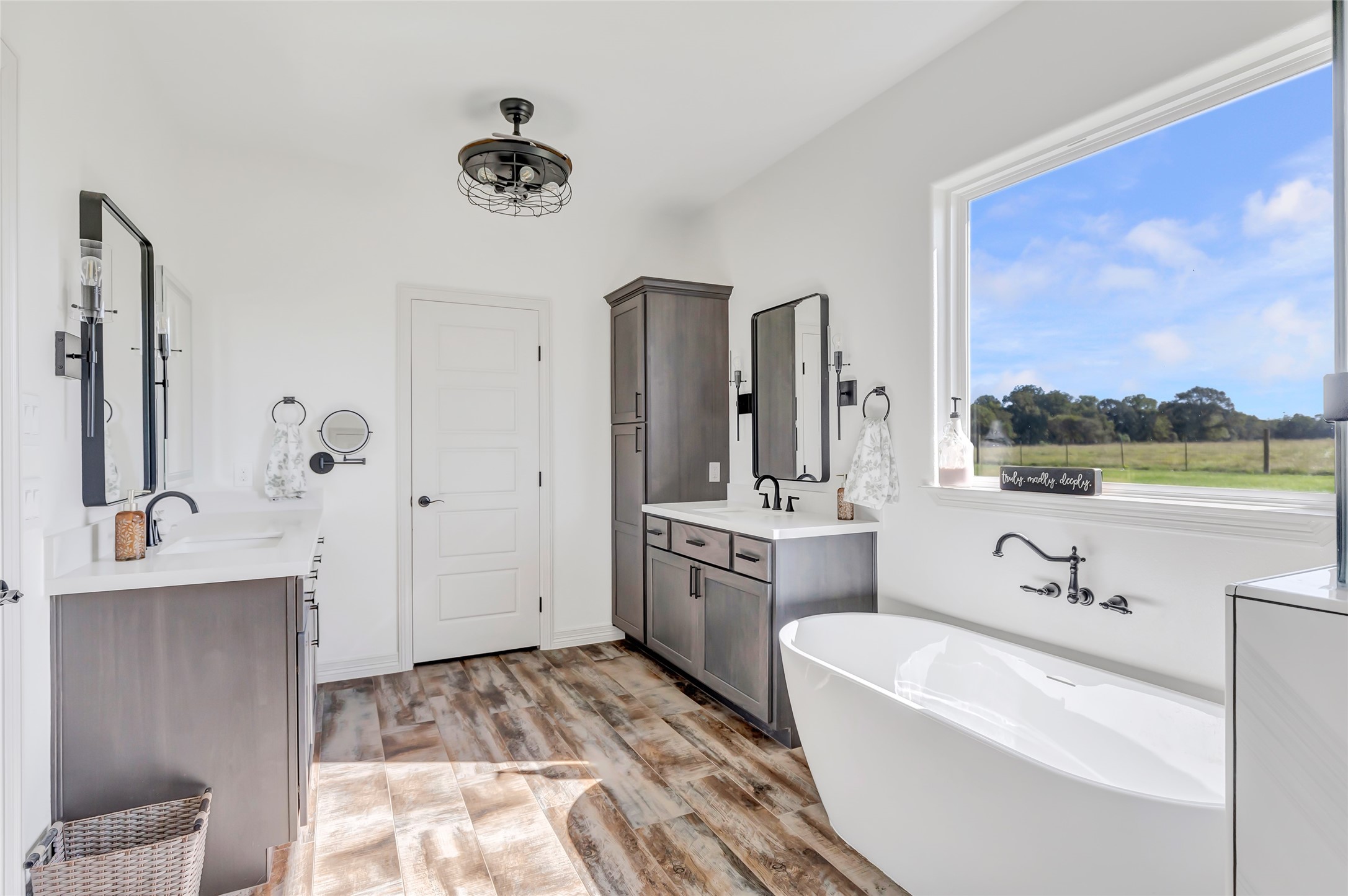 136 Timber Ridge Road Liberty, TX 77575 - Photo 22 of 50 a spacious bathroom with a tub sink and mirror