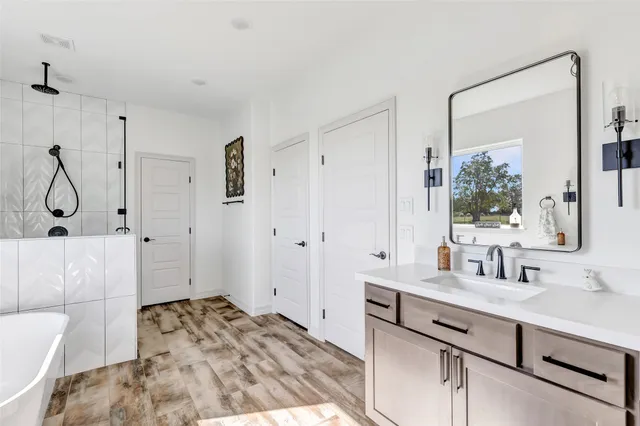 a bathroom with a sink and a mirror
