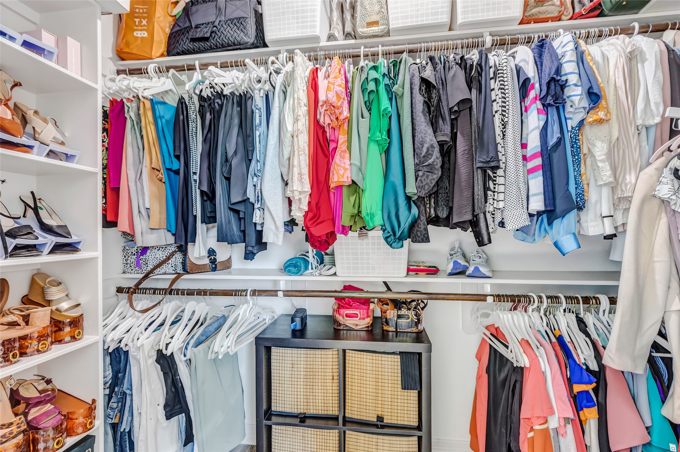 136 Timber Ridge Road Liberty, TX 77575 - Photo 26 of 50 a view of walk in closet with clothes