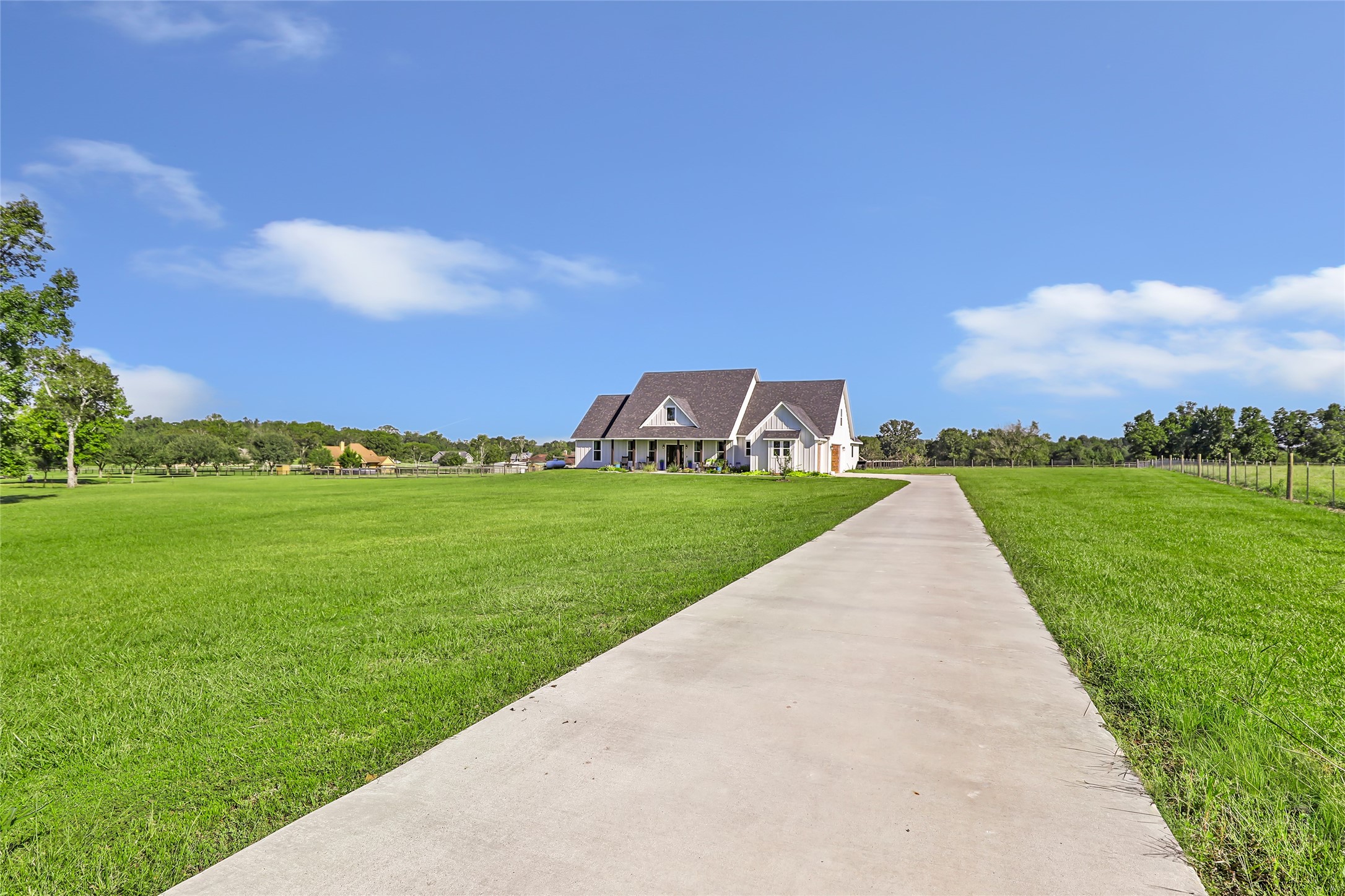 136 Timber Ridge Road Liberty, TX 77575 - Photo 40 of 50 a view of a garden with a building in the background