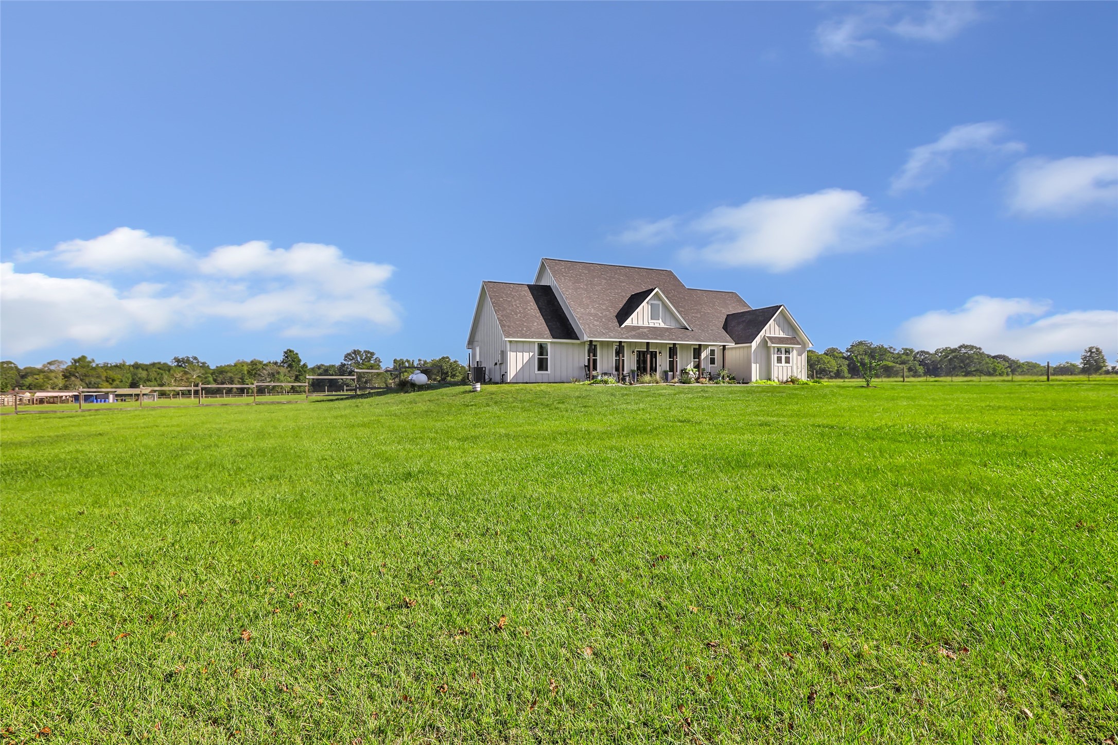 136 Timber Ridge Road Liberty, TX 77575 - Photo 42 of 50 a view of a green field with house in the background