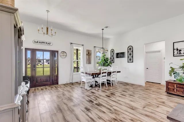 a view of a dining room with furniture window and wooden floor