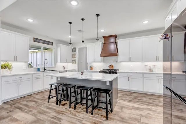 a kitchen with a table and chairs in it