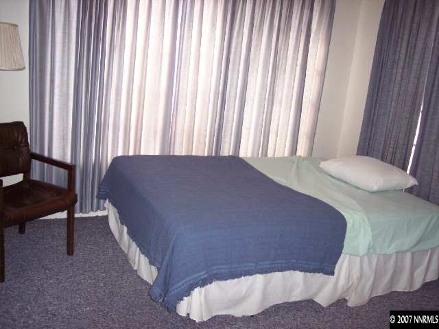 617 Kuenzli Street Reno, NV 89502 - Photo 6 of 6 a bed sitting in a bedroom next to a window