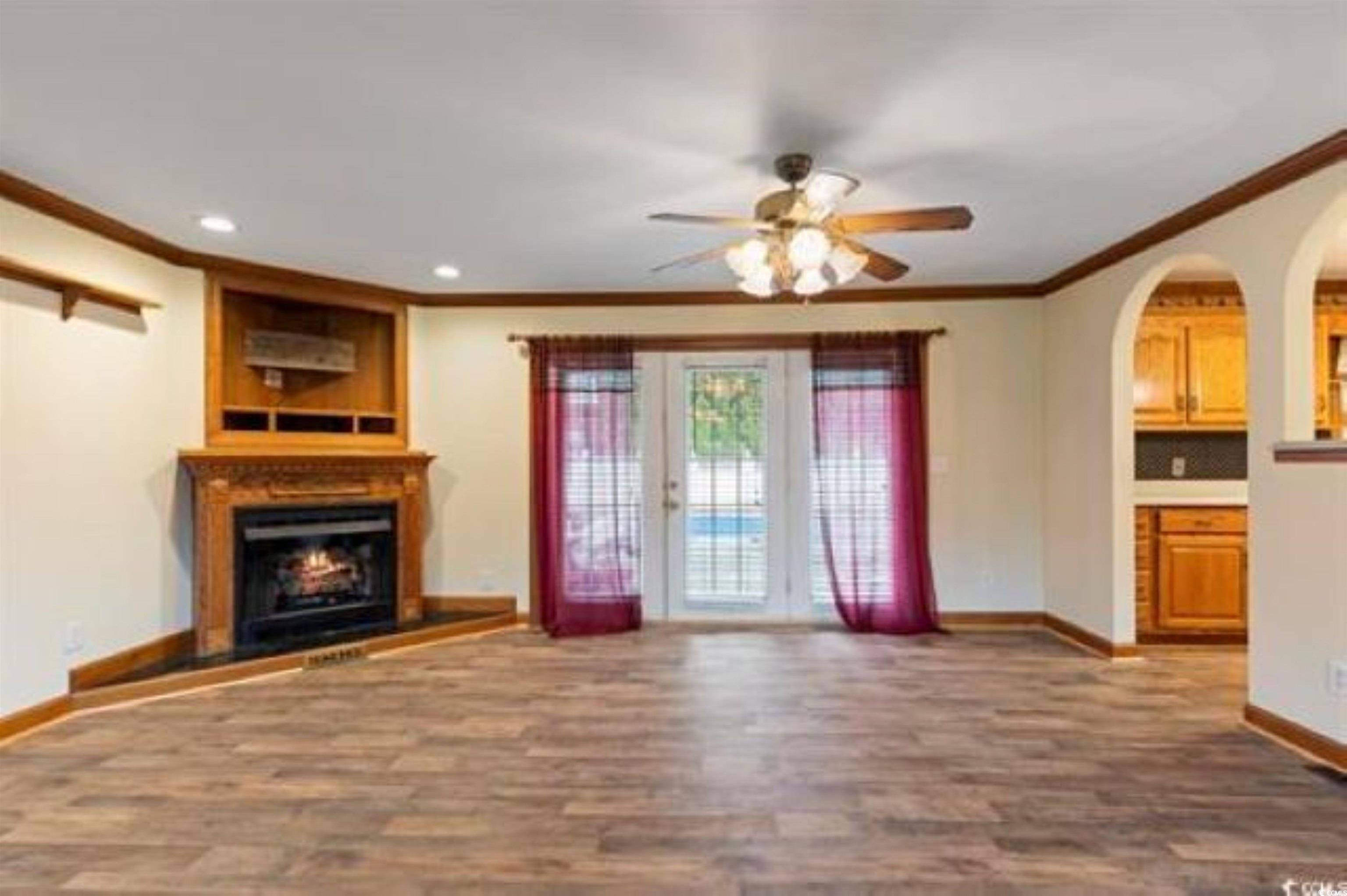 3503 Pinewood Drive Loris, SC 29569 - Photo 3 of 9 Unfurnished living room with dark wood-style floor
