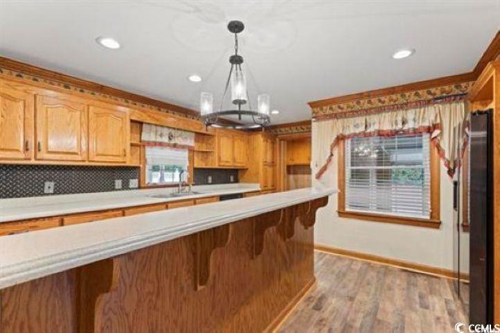 3503 Pinewood Drive Loris, SC 29569 - Photo 4 of 9 Kitchen with an inviting chandelier, open shelves,