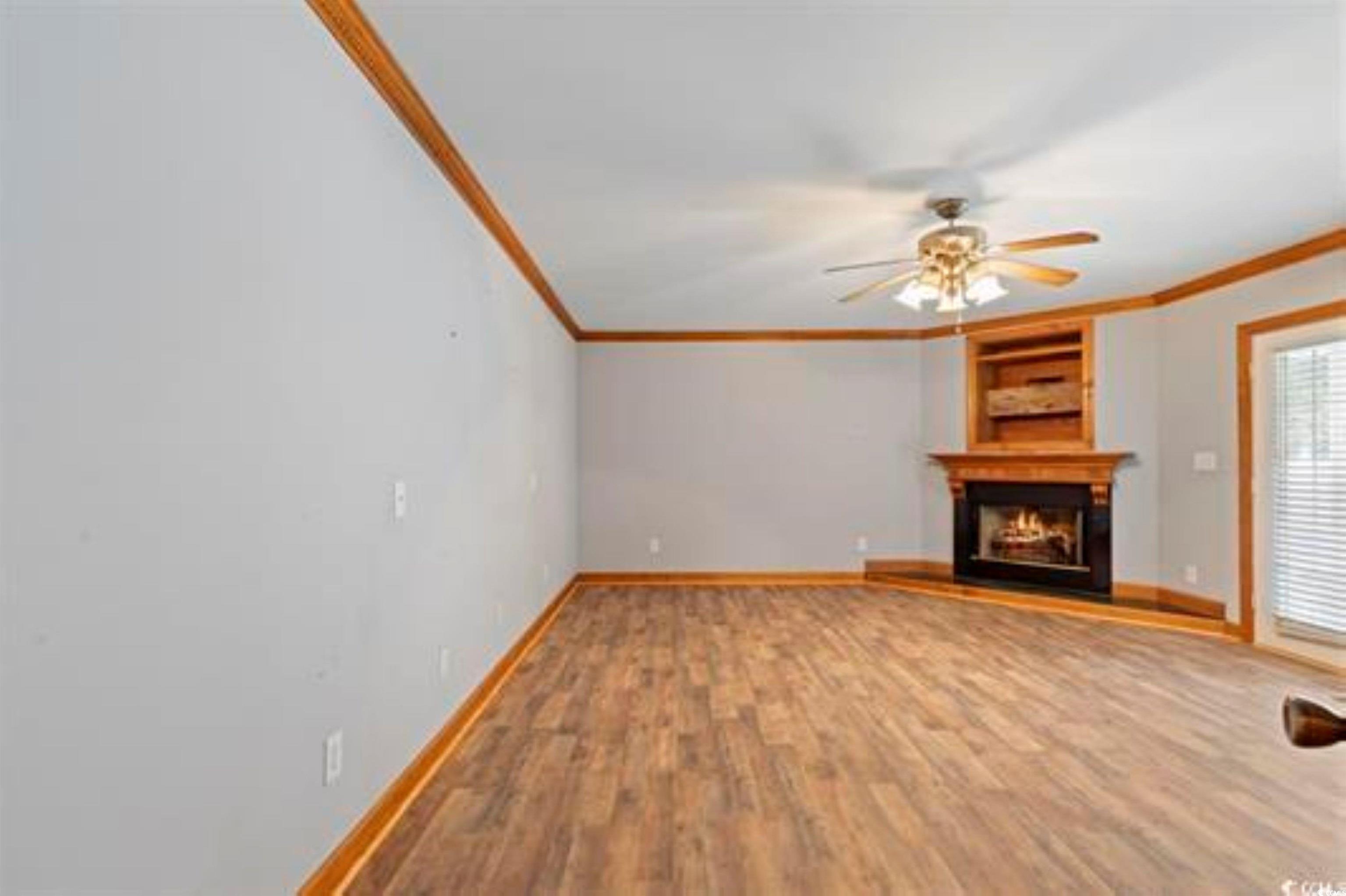 3503 Pinewood Drive Loris, SC 29569 - Photo 5 of 9 Unfurnished living room featuring baseboards, a wa
