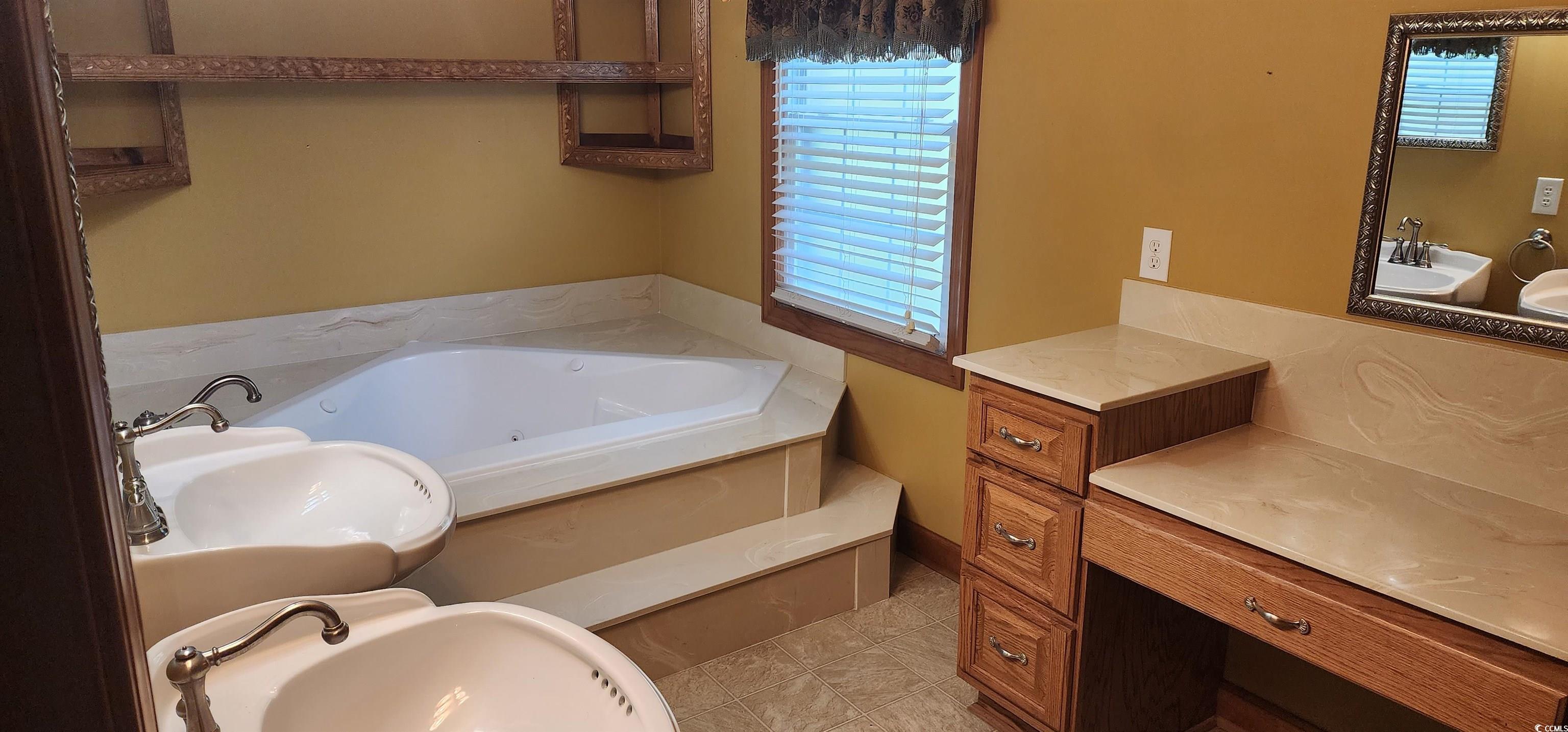3503 Pinewood Drive Loris, SC 29569 - Photo 6 of 9 Bathroom with a sink and a tub with jets