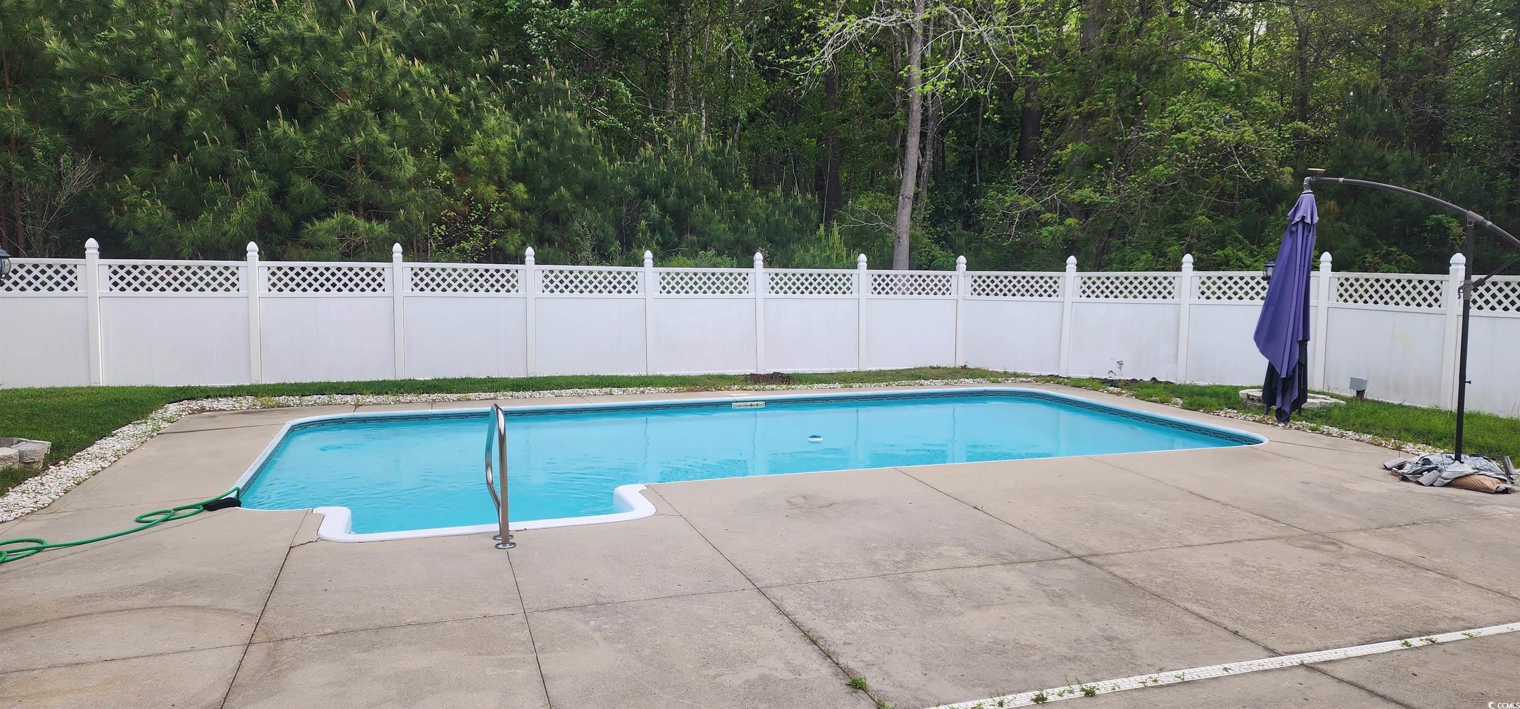 3503 Pinewood Drive Loris, SC 29569 - Photo 8 of 9 View of swimming pool with a patio area, fence, an