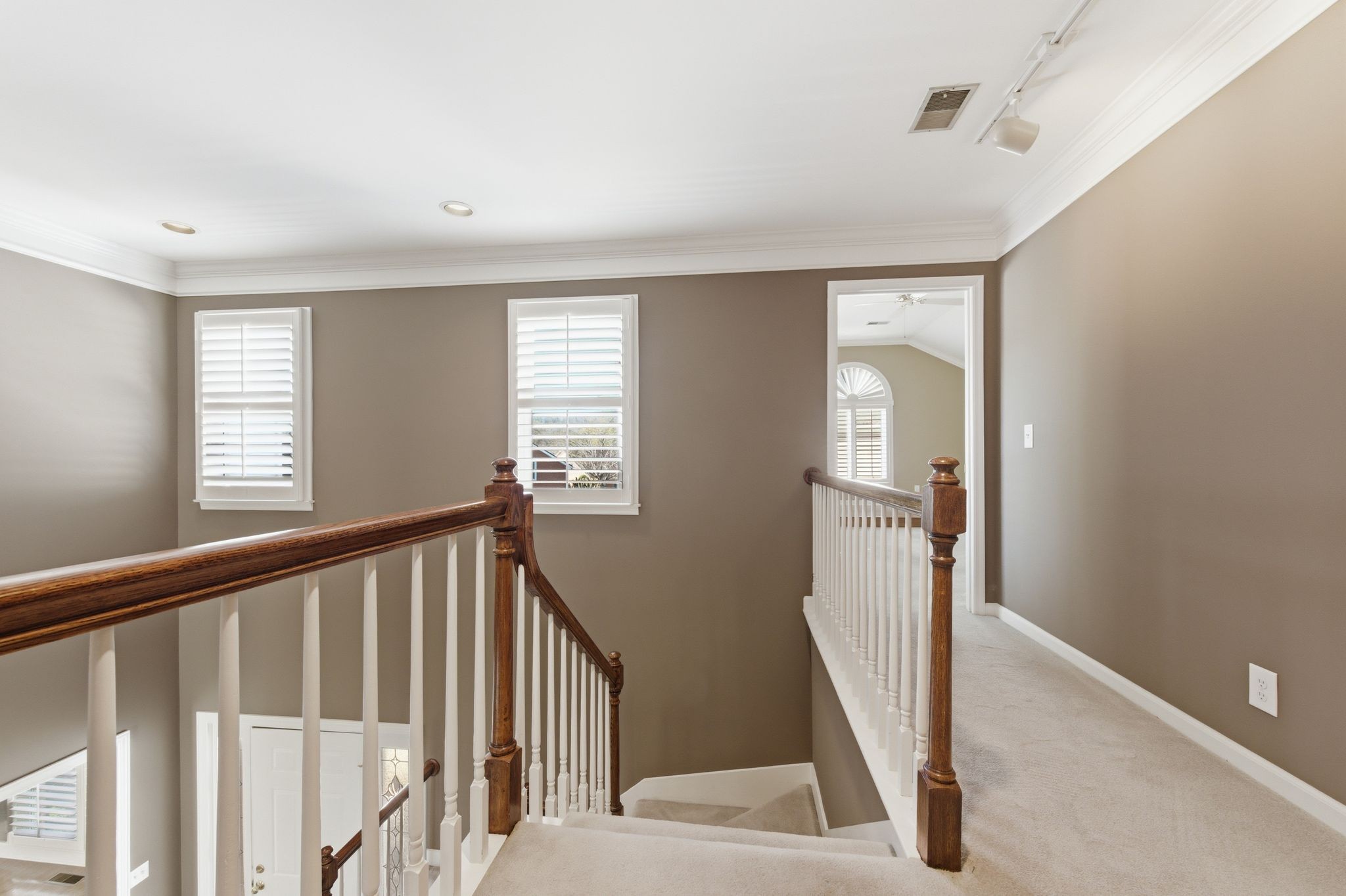 202 Bramley Place Franklin, TN 37069 - Photo 17 of 32 a view of a hallway with windows and stairs