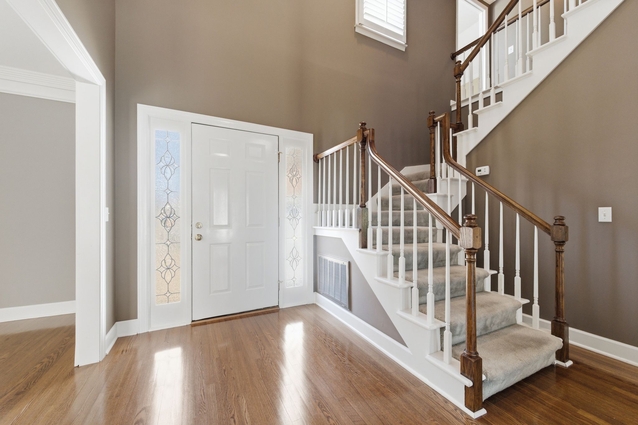 202 Bramley Place Franklin, TN 37069 - Photo 4 of 32 a view of staircase with wooden floor and a rug