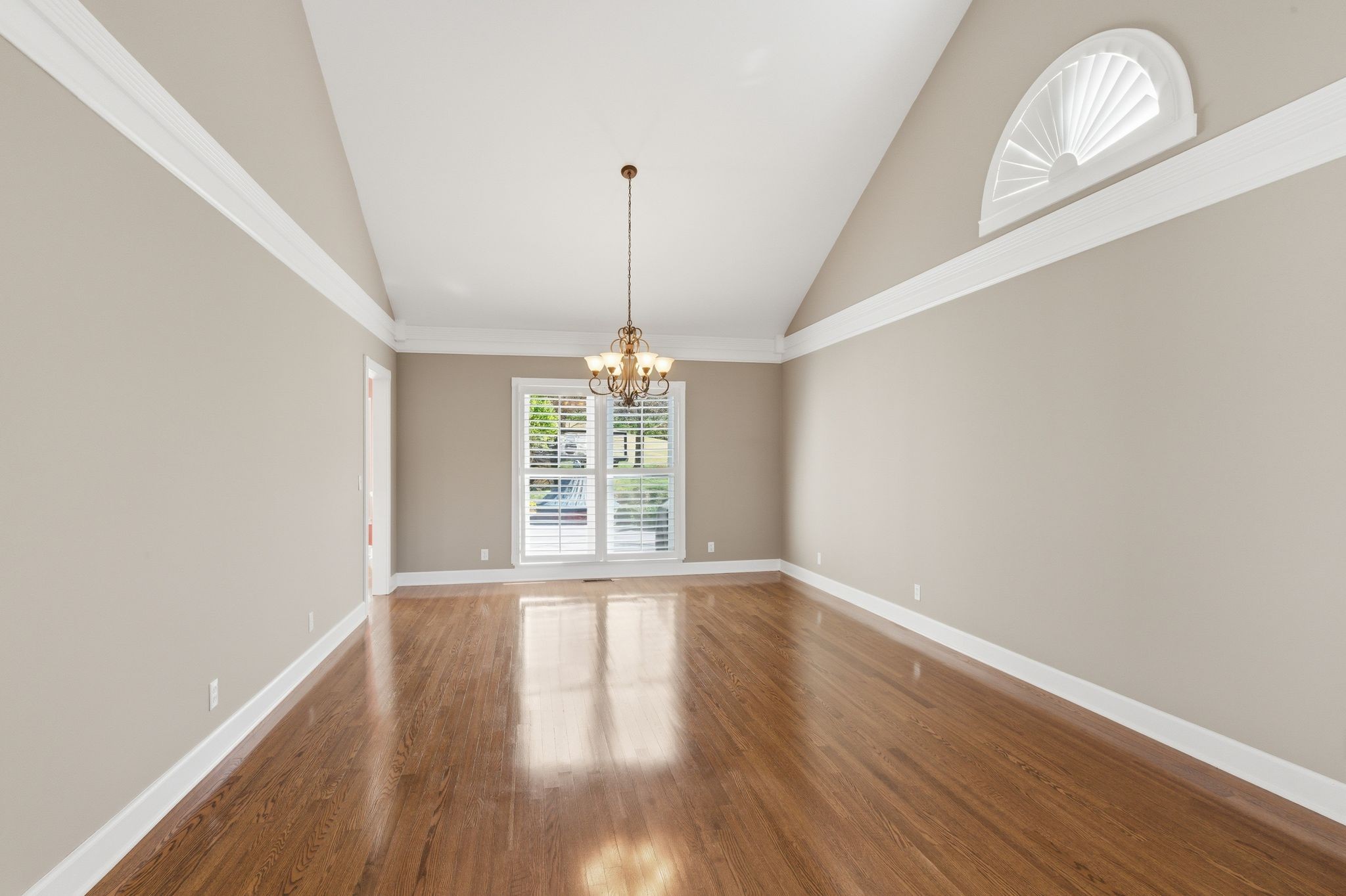 202 Bramley Place Franklin, TN 37069 - Photo 8 of 32 a view of an empty room with wooden floor and a window