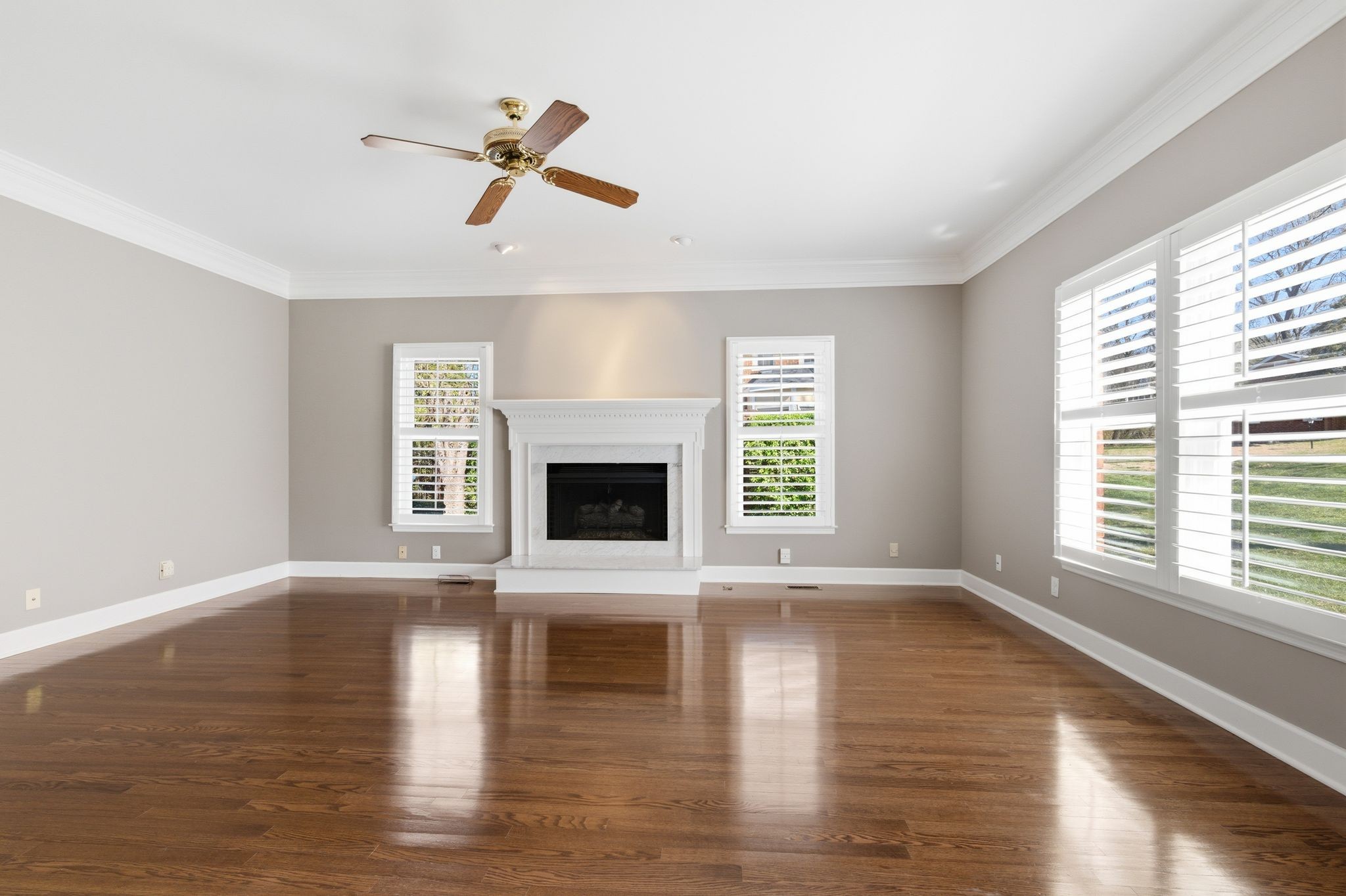 202 Bramley Place Franklin, TN 37069 - Photo 9 of 32 a view of an empty room with wooden floor and a window