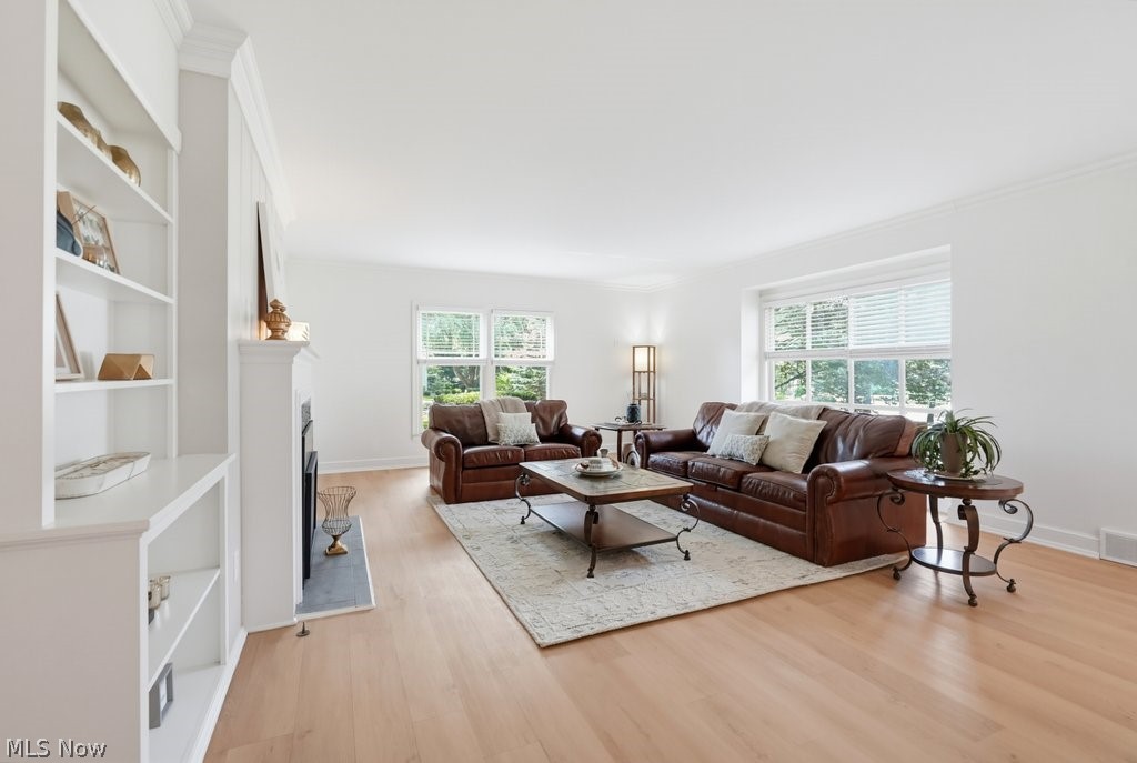 2468 Ridgewood Road Akron, OH 44313 - Photo 16 of 50 Living space featuring light wood-finish flooring, white walls, and bright windows
