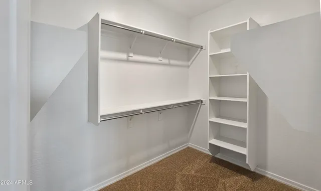 a view of an empty walk in closet