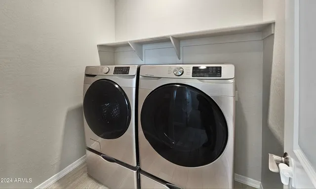 a utility room with dryer and washer