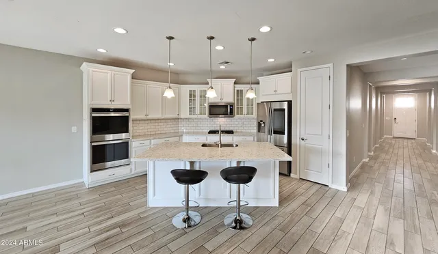 a view of kitchen with cabinets and wooden floor
