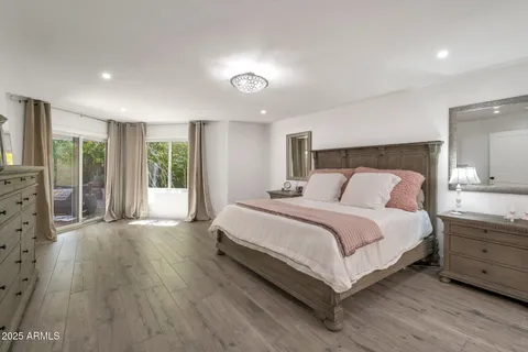 a large kitchen with stainless steel appliances a sink and a refrigerator