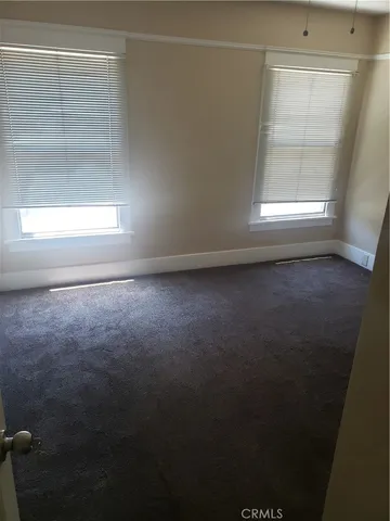 an empty room with a empty space and a window