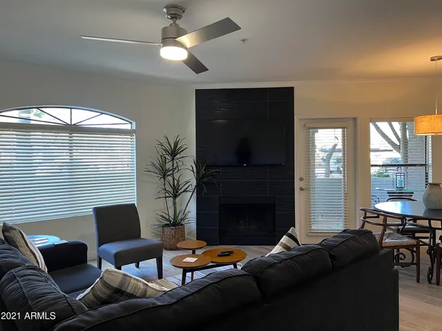 a view of a dining room with furniture and a large window