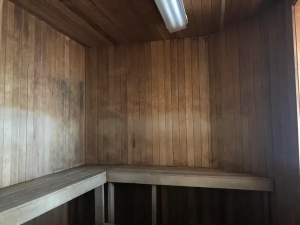 a bathroom with a toilet and shower