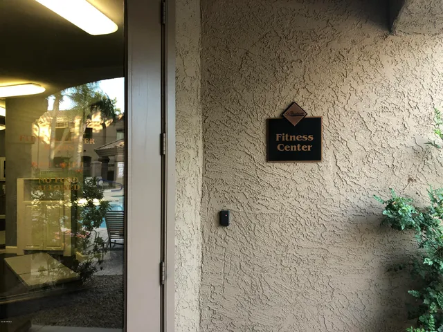 a view of a dining room with furniture wooden floor and a potted plant