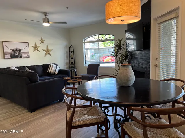 a kitchen with a refrigerator and a sink
