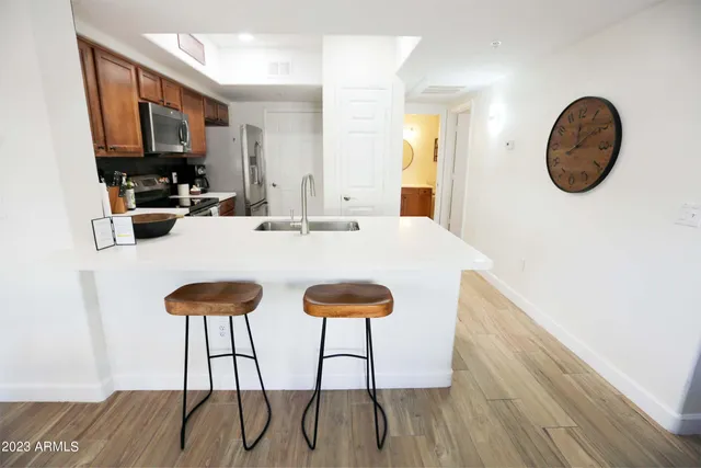 a view of a porch with dining table and chairs
