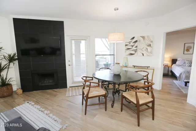 a backyard of a house with lots of green space and fountain