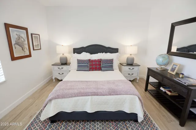 a view of a building with sitting area and furniture