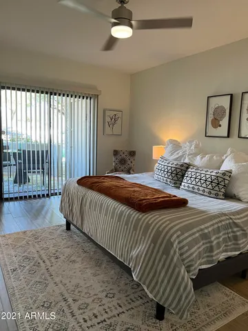 a bathroom with a toilet sink a shower and a mirror