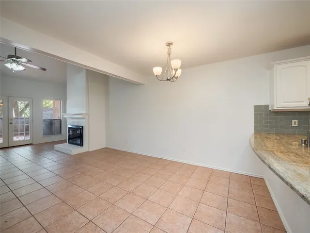 a view of a kitchen with a sink and a refrigerator